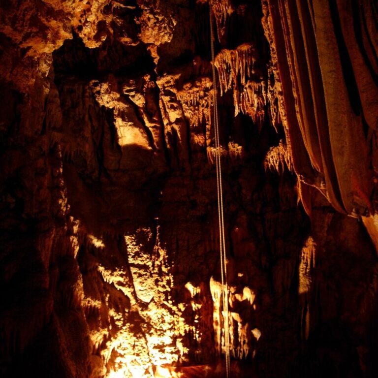 View of Baredine Cave's interior in Istria, Croatia, showing illuminated stalactites and stalagmites.