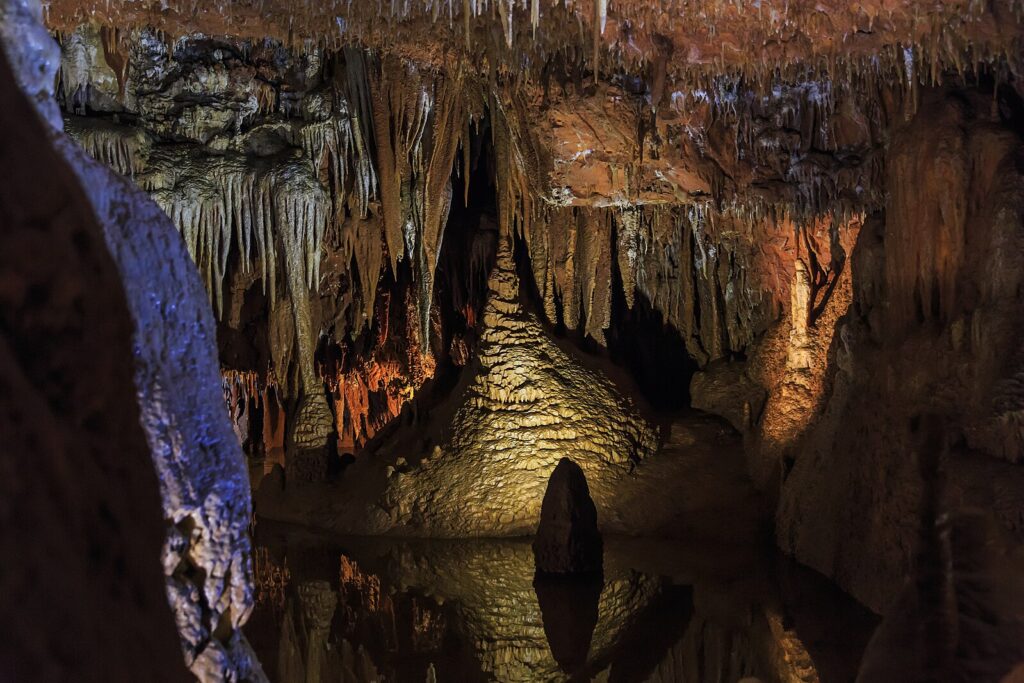 Close-up view of intricate cave decorations including stalactites and stalagmites in Baredine Cave.